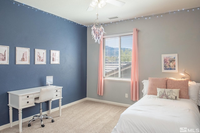 carpeted bedroom featuring visible vents and baseboards