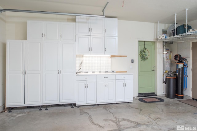 garage featuring gas water heater