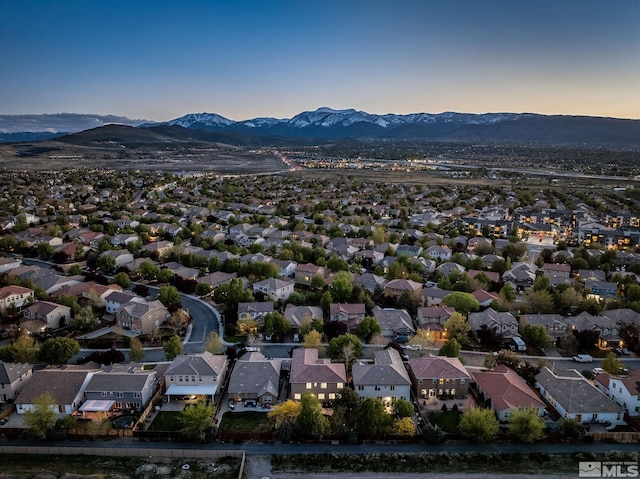 aerial view at dusk with a residential view and a mountain view