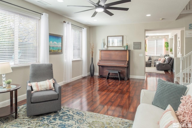 living area featuring plenty of natural light, a ceiling fan, wood finished floors, and recessed lighting