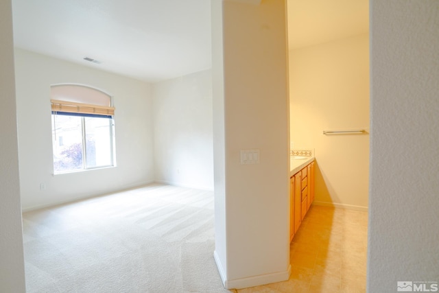 bathroom with vanity, baseboards, and visible vents
