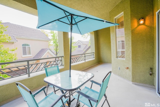 view of patio featuring a balcony