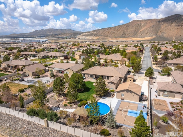 drone / aerial view with a residential view and a mountain view
