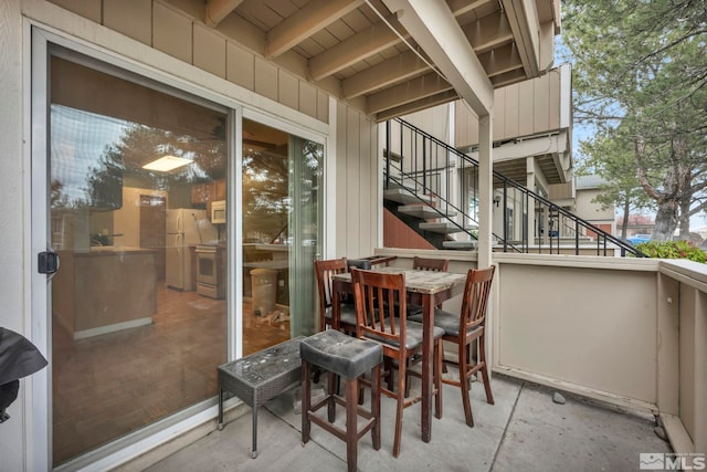 balcony featuring stairway