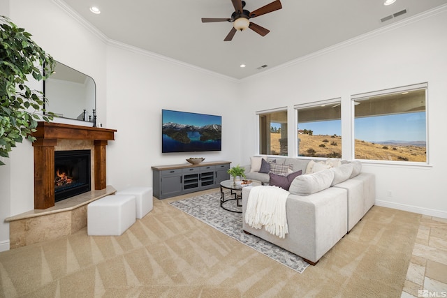 living room featuring ceiling fan, a premium fireplace, recessed lighting, visible vents, and ornamental molding