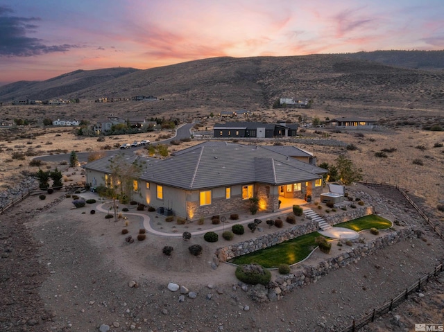 bird's eye view with a mountain view and view of desert