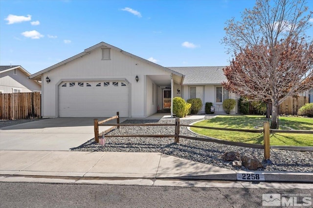 ranch-style house with driveway, fence, a front lawn, an attached garage, and a shingled roof