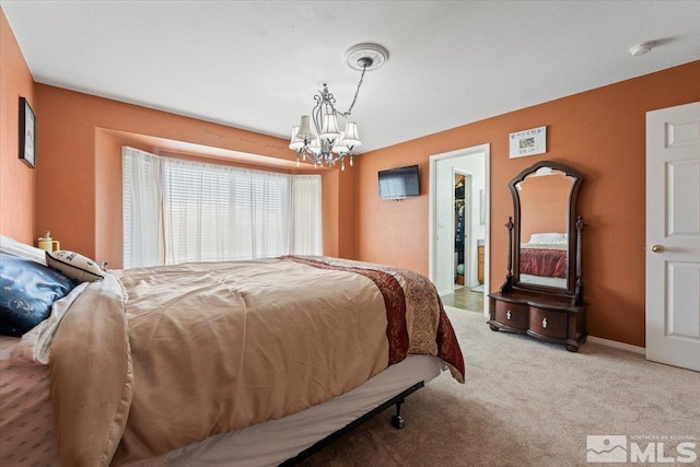 bedroom featuring an inviting chandelier and carpet floors