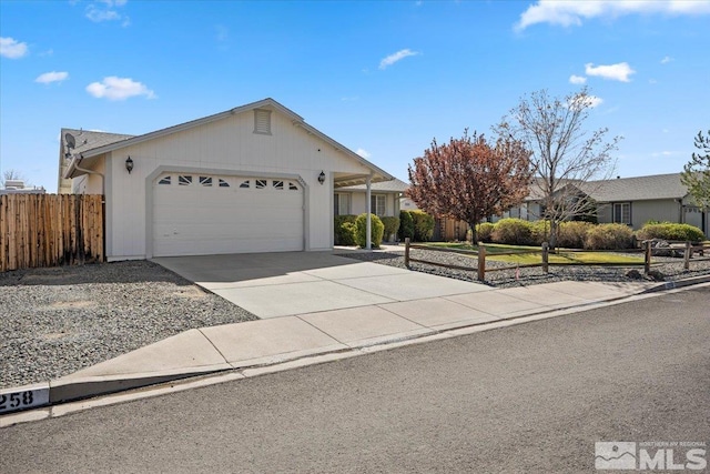 single story home featuring a garage, fence, and driveway