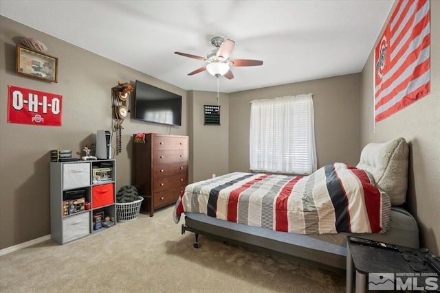 carpeted bedroom featuring a ceiling fan