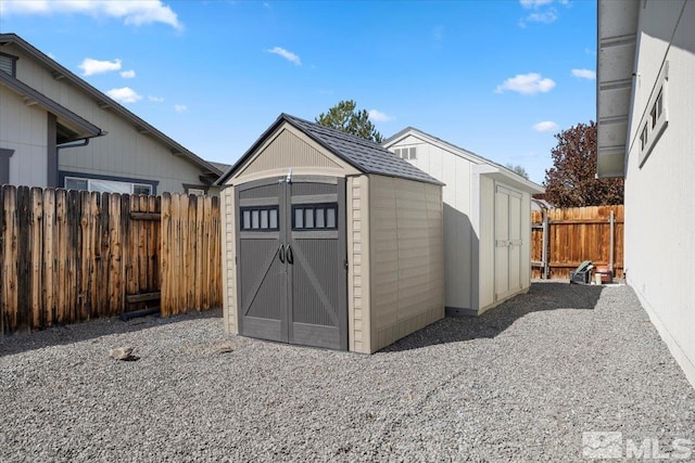 view of shed featuring a fenced backyard