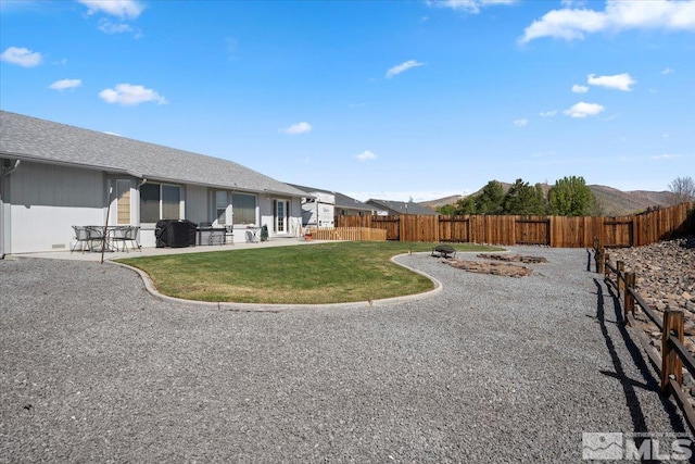 view of yard featuring a fenced backyard and a patio