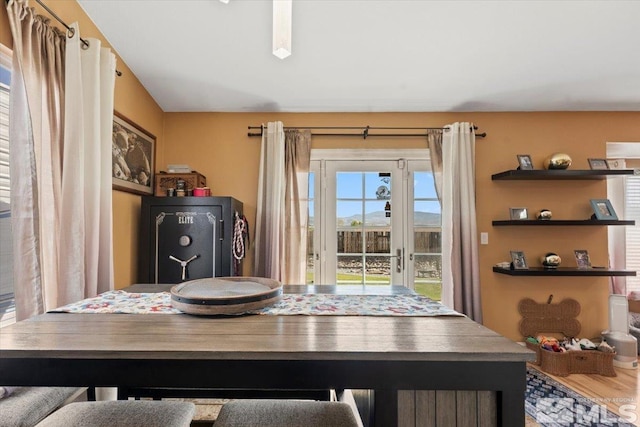 dining space with wood finished floors