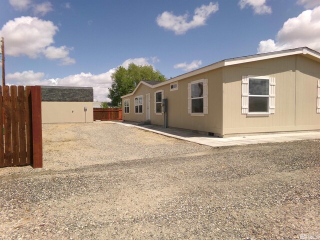 view of side of property with fence