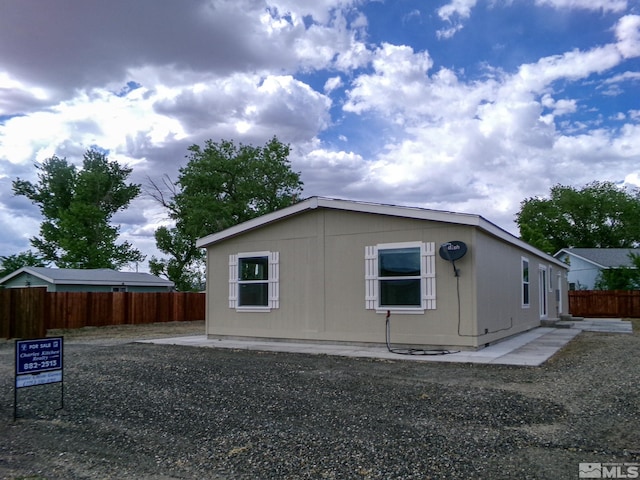 view of property exterior featuring fence