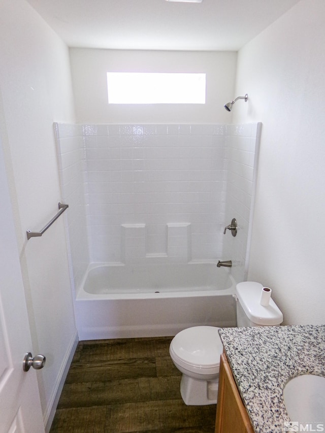 full bathroom with a healthy amount of sunlight, vanity, toilet, and wood finished floors
