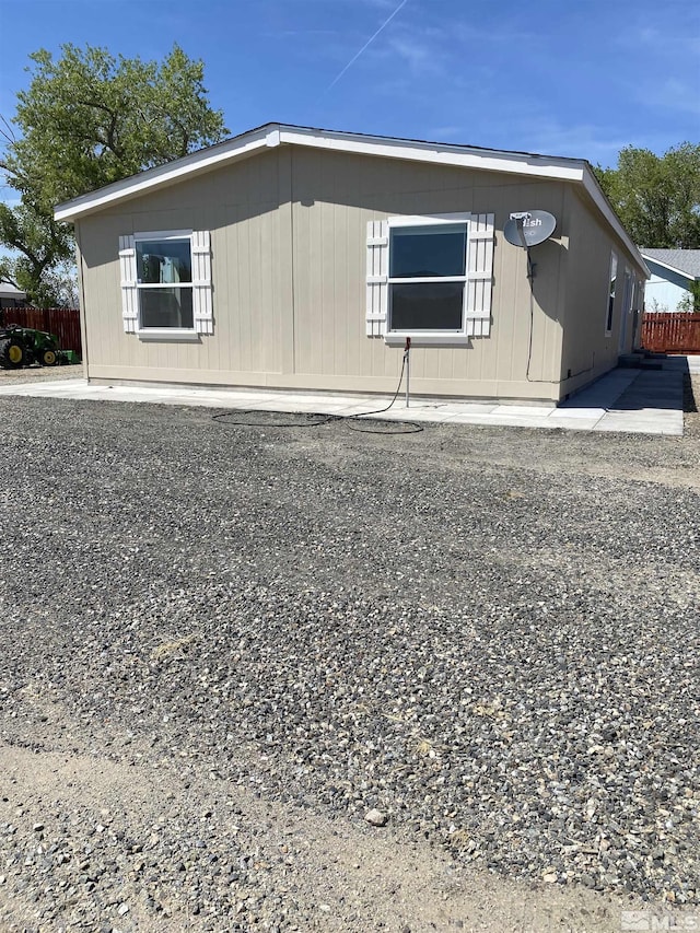 view of property exterior with fence