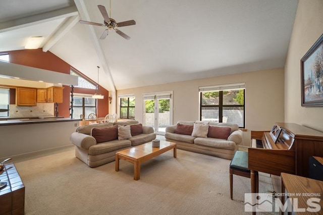 living area with beamed ceiling, light carpet, ceiling fan, and high vaulted ceiling