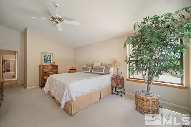bedroom with baseboards, vaulted ceiling, light carpet, and ceiling fan
