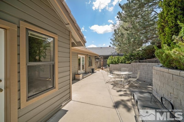view of patio / terrace featuring fence and outdoor dining space