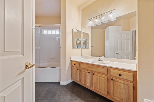 full bath with vanity, combined bath / shower with glass door, and tile patterned flooring