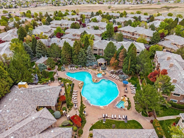 birds eye view of property with a residential view