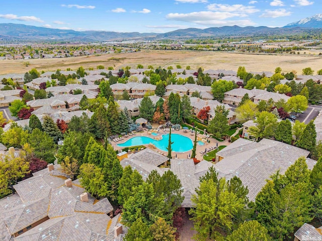 birds eye view of property featuring a mountain view