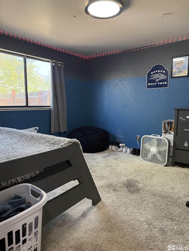 carpeted bedroom with a textured ceiling