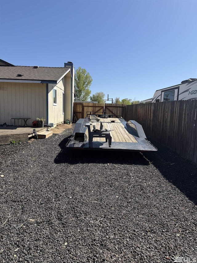 view of yard featuring a fenced backyard and a deck