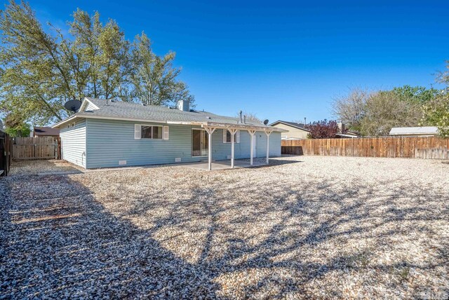 back of property featuring a patio and a fenced backyard