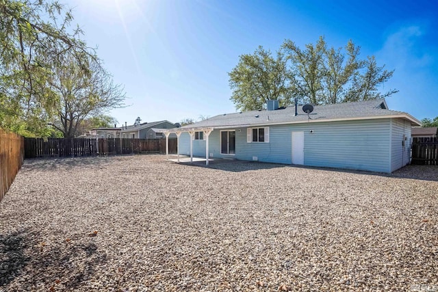 back of property featuring a fenced backyard and a patio area