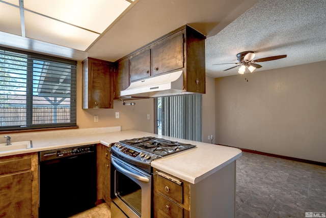 kitchen featuring a peninsula, ceiling fan, under cabinet range hood, dishwasher, and gas stove