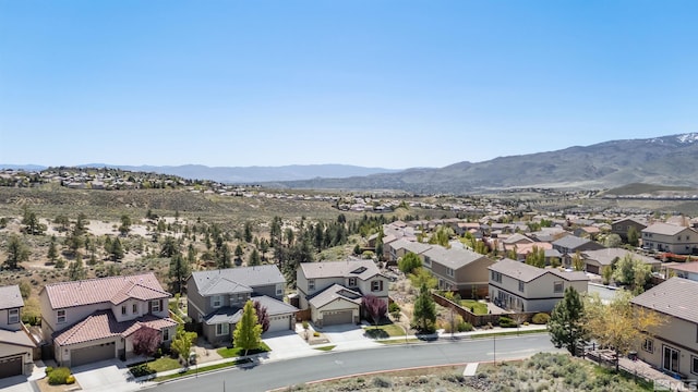 aerial view featuring a mountain view and a residential view