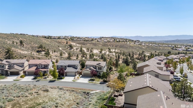 birds eye view of property with a residential view and a mountain view