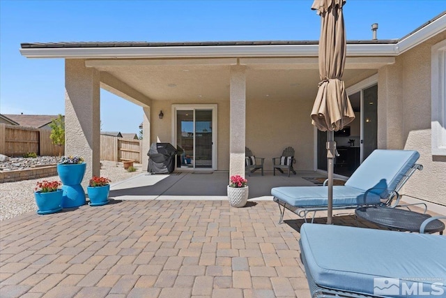 view of patio / terrace with fence
