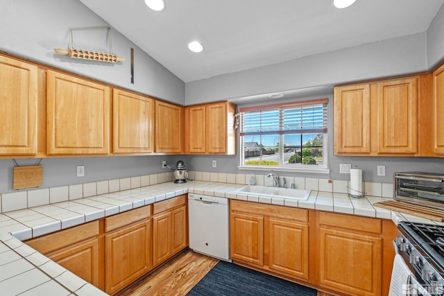 kitchen with gas stove, a sink, dishwasher, recessed lighting, and a toaster