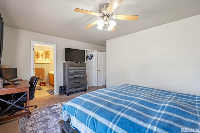 bedroom with light colored carpet, a ceiling fan, and ensuite bath