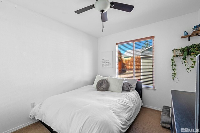 bedroom with carpet floors, a ceiling fan, and baseboards