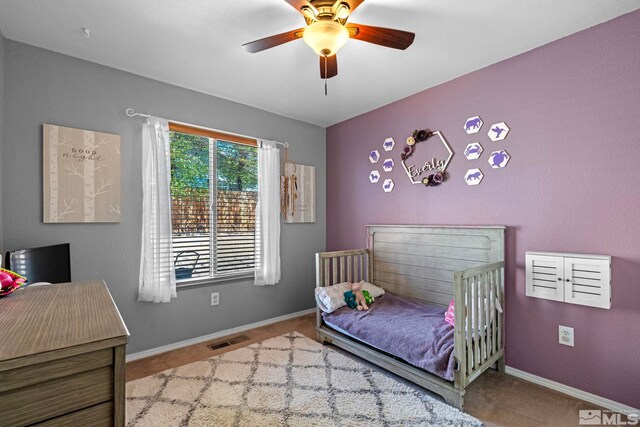 bedroom featuring visible vents, baseboards, carpet floors, and ceiling fan