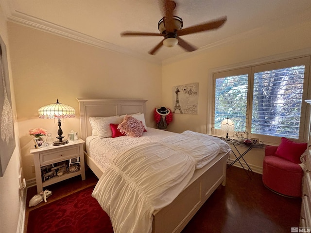 bedroom with baseboards, ornamental molding, and a ceiling fan