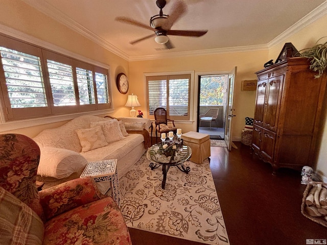 living room with crown molding, plenty of natural light, and a ceiling fan