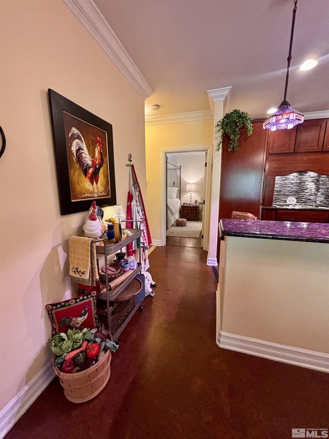 corridor featuring baseboards and ornamental molding