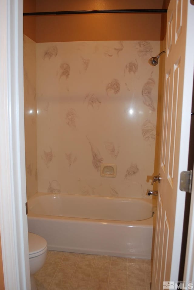 full bath with tile patterned floors, toilet, and shower / washtub combination
