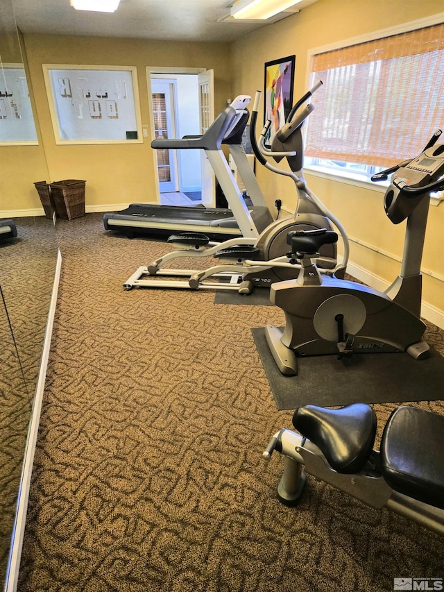 gym featuring baseboards
