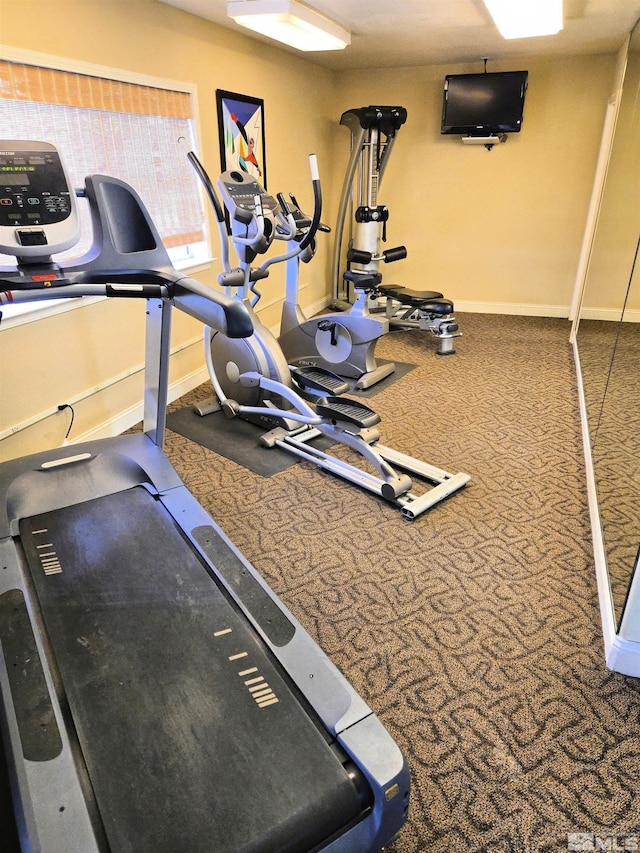 exercise room with baseboards
