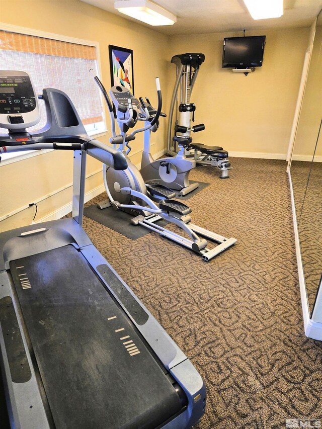 exercise room with baseboards