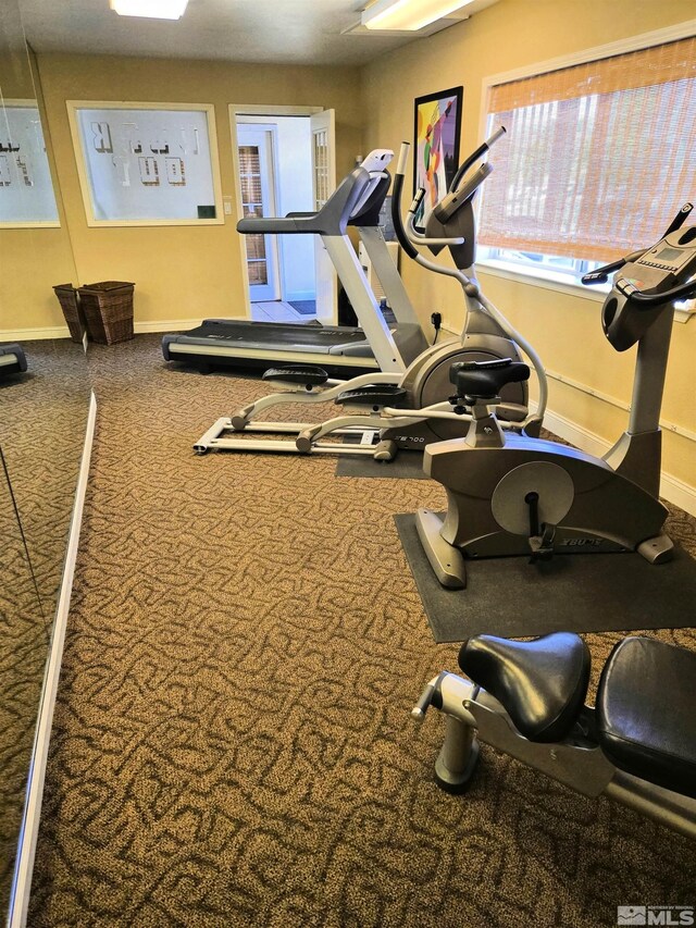 gym featuring baseboards