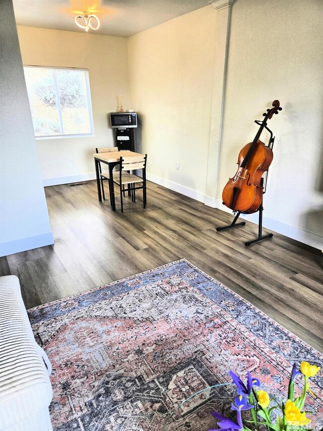 sitting room featuring wood finished floors and baseboards