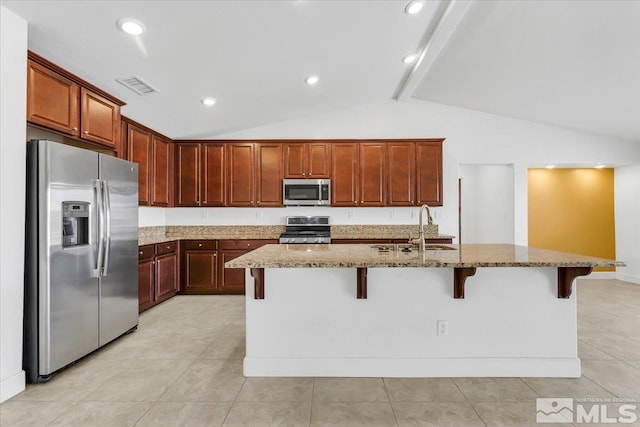 kitchen with lofted ceiling with beams, a sink, stone countertops, stainless steel appliances, and visible vents