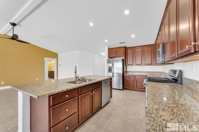 kitchen featuring a sink, appliances with stainless steel finishes, light tile patterned floors, and visible vents